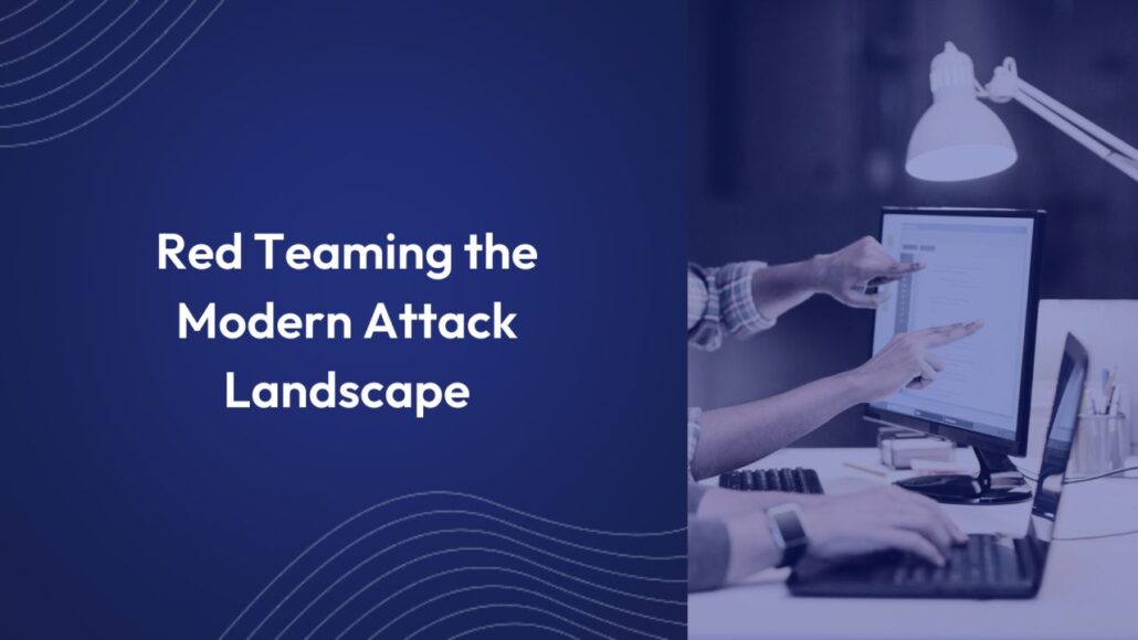 Navy background with lines in the corner with the white text "Red Teaming the Modern Attack Landscape" over it on the left side of the image. To the right is a desktop monitor and a laptop, with 2 peoples' hands pointing at the screens.